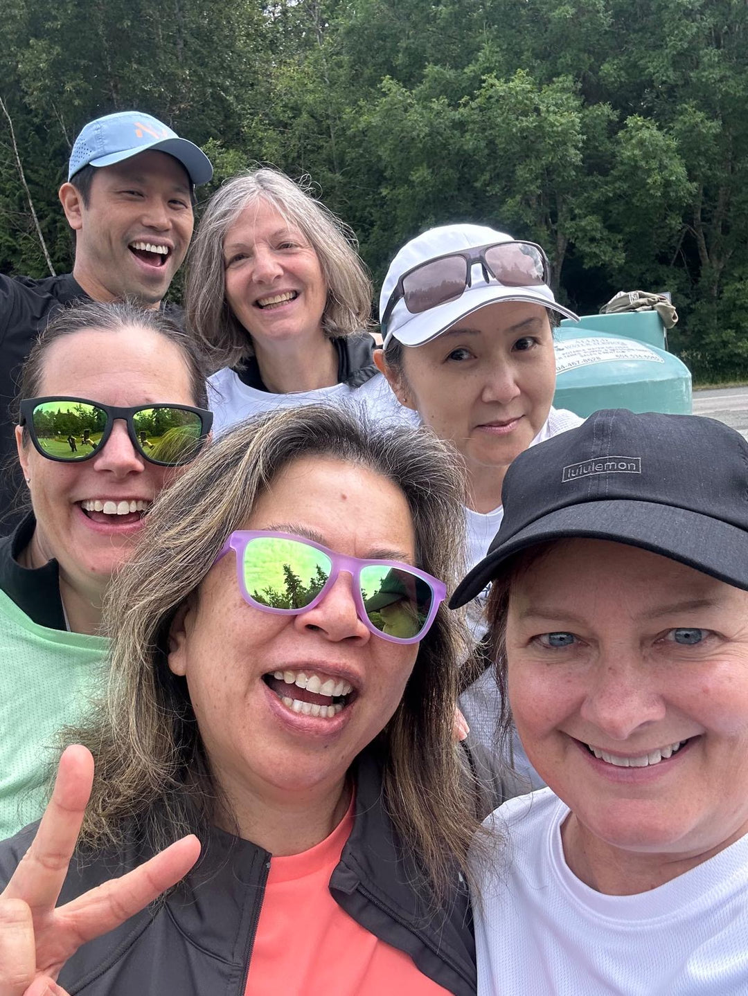 A group of smiling striderz runners at the Vancouver Half marathon event